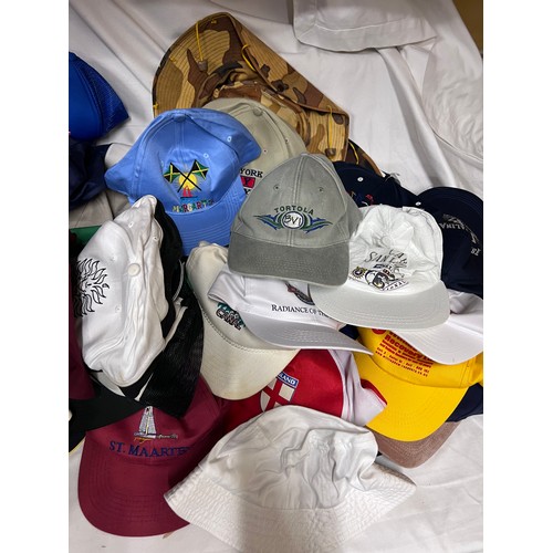 944 - A large quantity of mainly baseball caps collected over many years from multiple holiday destination... 