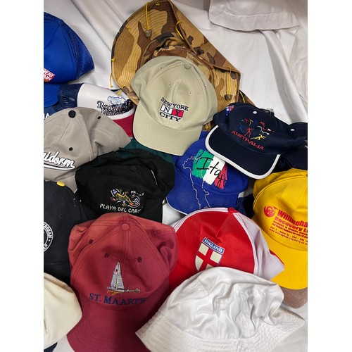 944 - A large quantity of mainly baseball caps collected over many years from multiple holiday destination... 