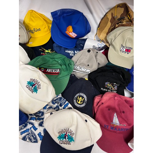 944 - A large quantity of mainly baseball caps collected over many years from multiple holiday destination... 