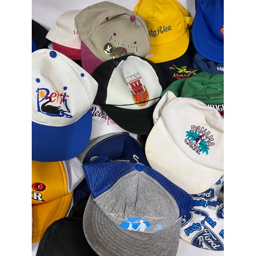 944 - A large quantity of mainly baseball caps collected over many years from multiple holiday destination... 