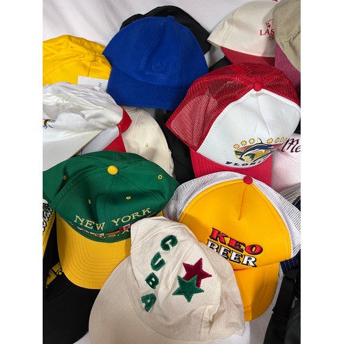 944 - A large quantity of mainly baseball caps collected over many years from multiple holiday destination... 