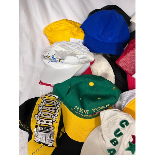 944 - A large quantity of mainly baseball caps collected over many years from multiple holiday destination... 