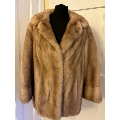 937 - A ladies short mink jacket with side splits from Ross (Furriers) Ltd, Lands Lane. Underarm to undera... 