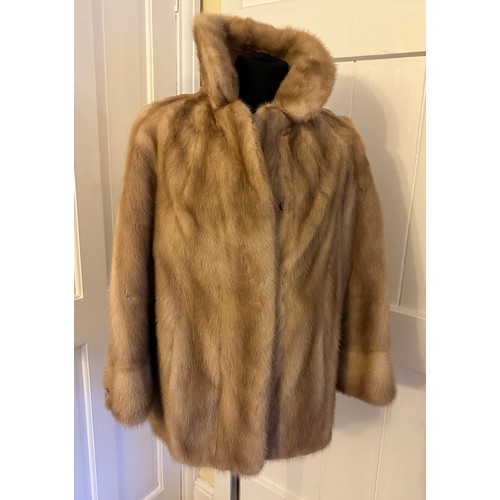 937 - A ladies short mink jacket with side splits from Ross (Furriers) Ltd, Lands Lane. Underarm to undera... 