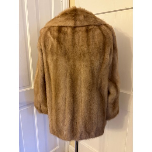 937 - A ladies short mink jacket with side splits from Ross (Furriers) Ltd, Lands Lane. Underarm to undera... 