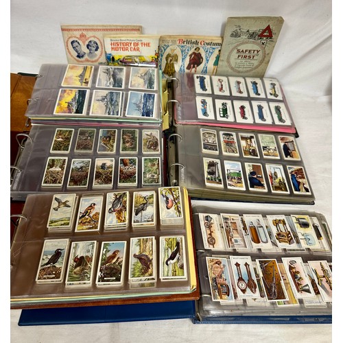 665 - A quantity of 6 albums of cigarette cards to include various topics, Football, Birds, Sportsmen, Cha... 