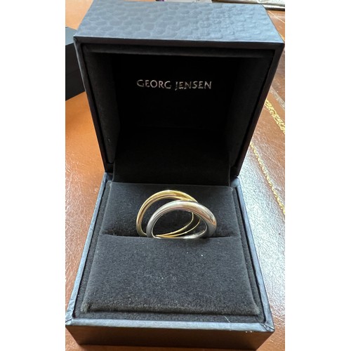 364 - Two Georg Jensen rings from the Offspring collection, one 18 carat gold 4.2gm and one silver. Approx... 