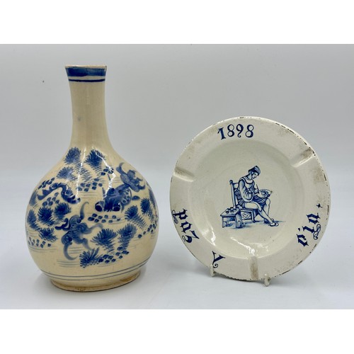 1156 - A pottery oriental vase, depicting fish 28cm h and a continental pottery blue and white ashtray 20.5... 