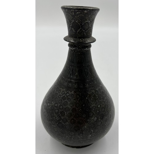 1165 - A 19thC Persian bronze and silver vase. 19cm h.