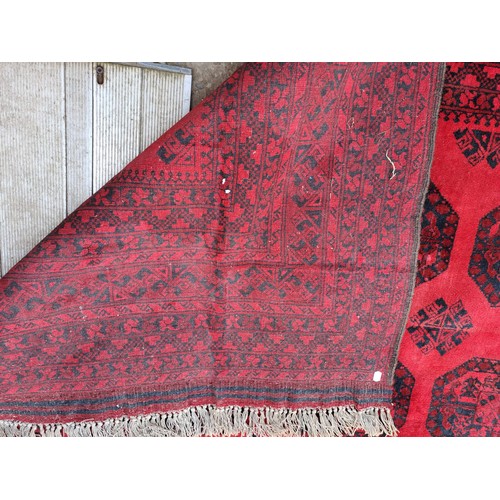 1240 - A good quality red ground carpet, 430cm x 370cm.