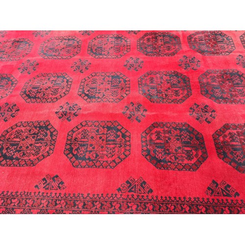 1240 - A good quality red ground carpet, 430cm x 370cm.