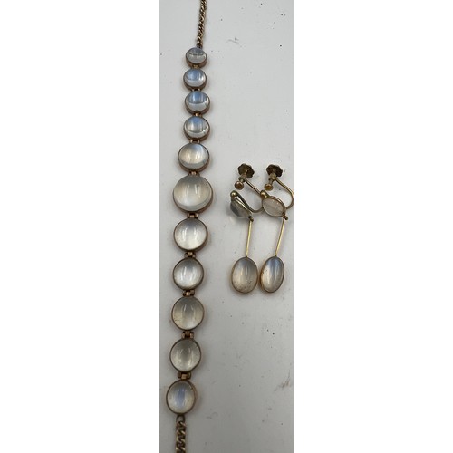 387 - Moonstone and 9 carat gold screw on drop earrings together with an unmarked yellow metal bracelet se... 