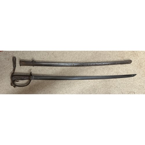 1203 - A Japanese model 1899 type 32 military sword and scabbard. Blade 30.5 inches. Numbered 8759 to top o... 