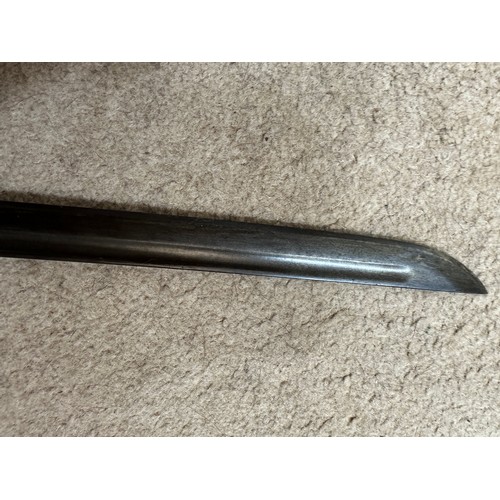 1203 - A Japanese model 1899 type 32 military sword and scabbard. Blade 30.5 inches. Numbered 8759 to top o... 