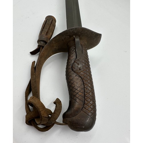 1203 - A Japanese model 1899 type 32 military sword and scabbard. Blade 30.5 inches. Numbered 8759 to top o... 