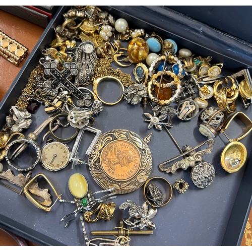 344 - A very large quantity of costume jewellery to include vintage watch movements, cufflinks, 2 x Nomina... 