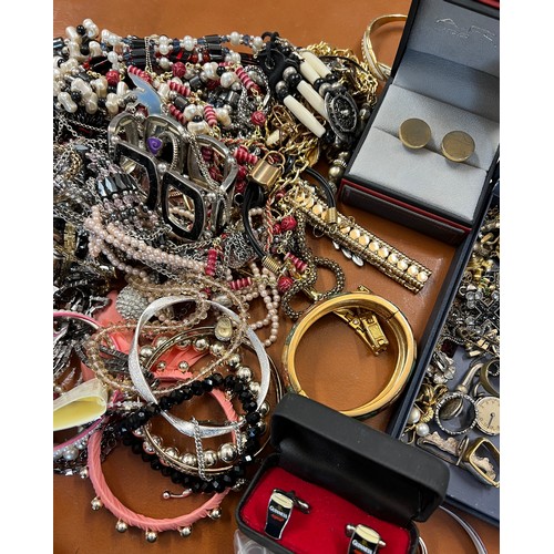 344 - A very large quantity of costume jewellery to include vintage watch movements, cufflinks, 2 x Nomina... 