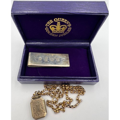 361 - A silver money clip for the Queens Golden Jubilee 2002 Sheffield and an unmarked yellow metal locket... 