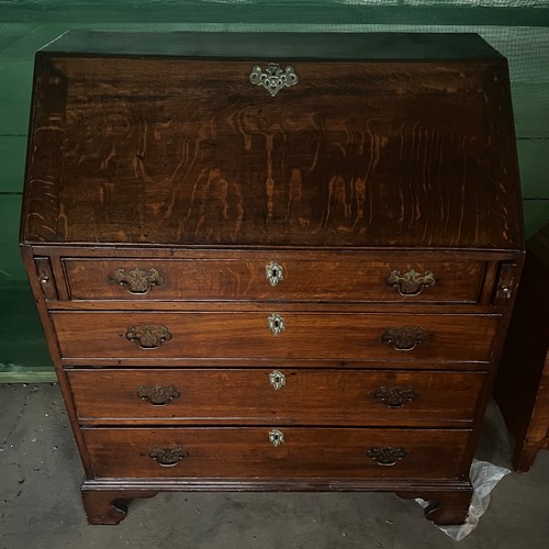 52 - A 19thC oak bureau with four graduated drawers and bracket feet with fitted interior. 92cm x 108cm  ... 