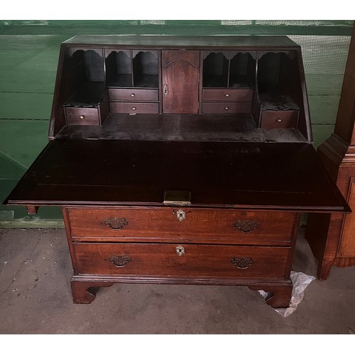52 - A 19thC oak bureau with four graduated drawers and bracket feet with fitted interior. 92cm x 108cm  ... 