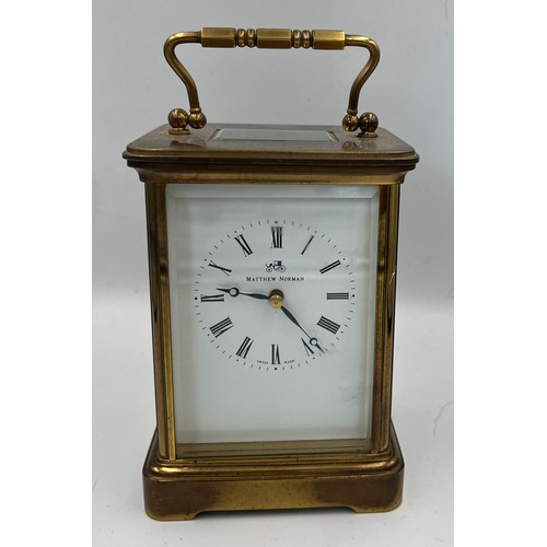 1273A - A brass cased Mathew Norman carriage clock with visible escapement. 13.5cm h.