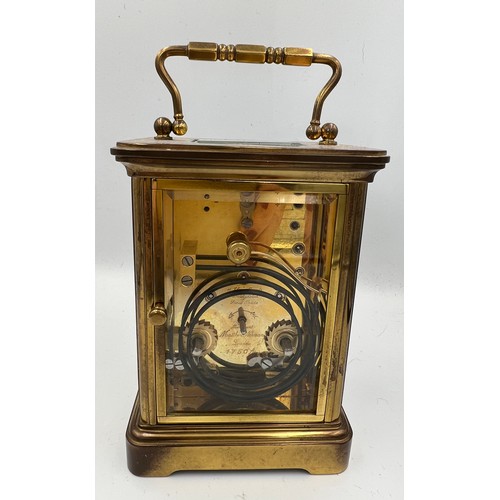 1273A - A brass cased Mathew Norman carriage clock with visible escapement. 13.5cm h.