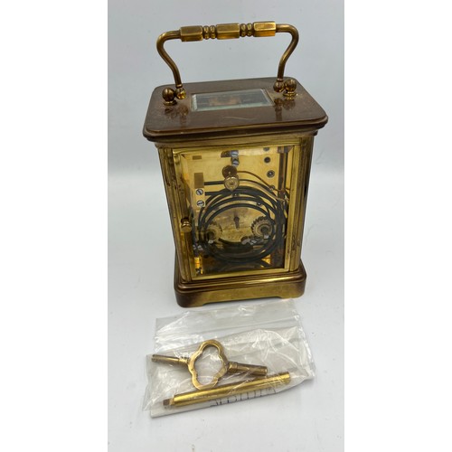 1273A - A brass cased Mathew Norman carriage clock with visible escapement. 13.5cm h.