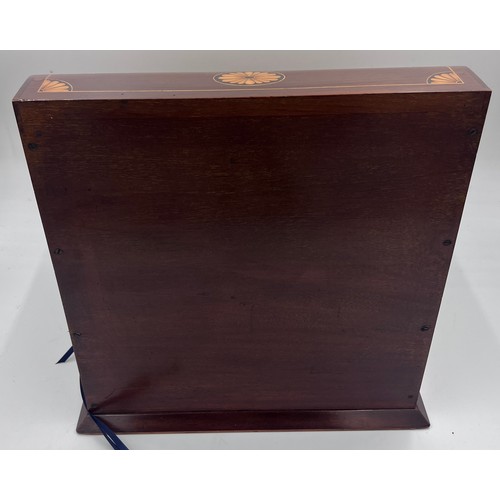 1274A - An Edwardian mahogany inlaid cut glass tantalus and games box containing cigar cutter, silver plated... 