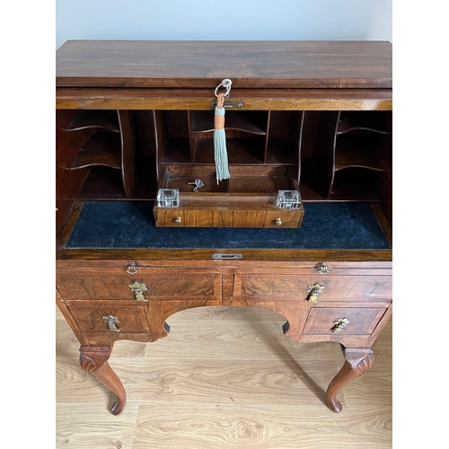 57B - A walnut roll top writing bureau on cabriole legs. 71 w x 46 d x 99cm h.