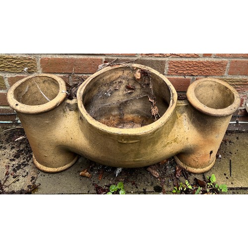 145 - A 19thC three hole chimney pot. 72cm w x 33cm h.