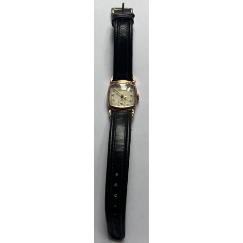 553 - A 10ct gold filled bezel vintage Westfield (Bulova) wristwatch on black leather strap. Case 25mm. 

... 