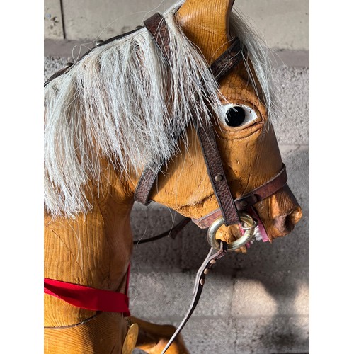 852 - Large vintage wooden rocking horse with horse hair mane and tail, leather bridle and saddle. 121cm h... 