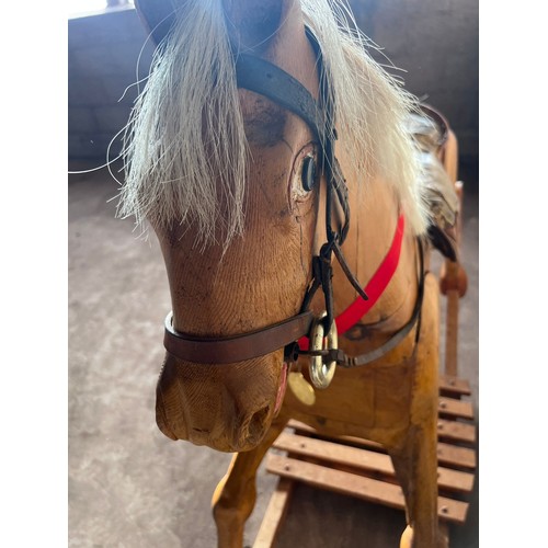 852 - Large vintage wooden rocking horse with horse hair mane and tail, leather bridle and saddle. 121cm h... 