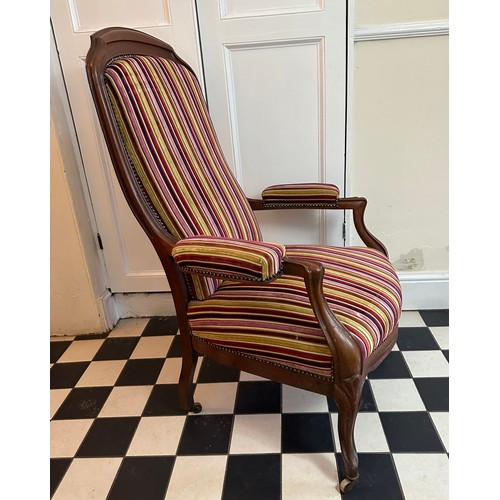 70 - A French mahogany high back armchair with upholstered seat, back and arms, front cabriole legs and c... 