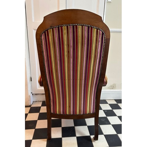 70 - A French mahogany high back armchair with upholstered seat, back and arms, front cabriole legs and c... 