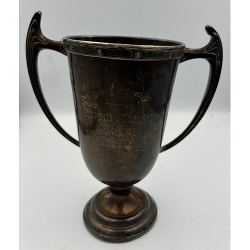 693 - A hallmarked silver trophy on stand, Birmingham 1967. Height 14.5cm. Weight without stand 203.2gm.