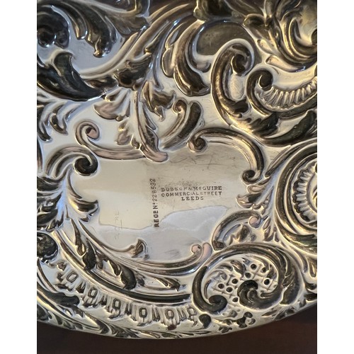 696 - A oval embossed silver dish, Sheffield 1896, maker Fenton, Russell & Co. Ltd. 24.5cm x 17.5 cm. Weig... 