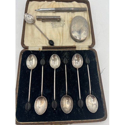 708 - Silver to include six boxed coffee bean teaspoons, Birmingham 1924, maker Hukin & Heath Ltd, a singl... 