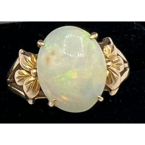 447 - An opal ring mounted in 14 carat yellow gold. Size R. Weight 4gm.