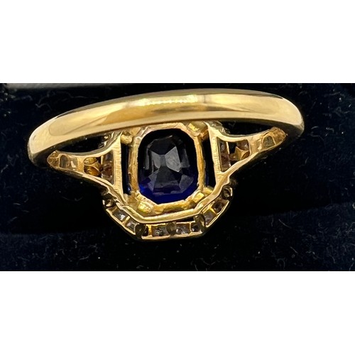 449 - A sapphire and diamond ring mounted in 18 carat gold and platinum. Size N/O. Weight 4.3gm. The cushi... 