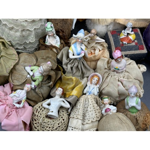 228 - A quantity of half doll pin cushions (29).