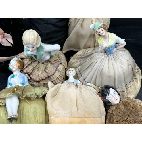 228 - A quantity of half doll pin cushions (29).