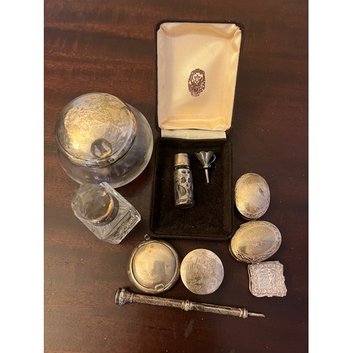 688 - Various items of silver and white metal marked .925 to include silver topped jar, scent bottles, fiv... 