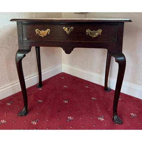 73 - An 18thC oak lowboy with trefoil pad feet. 74cm w x 47cm d x 65cm h.