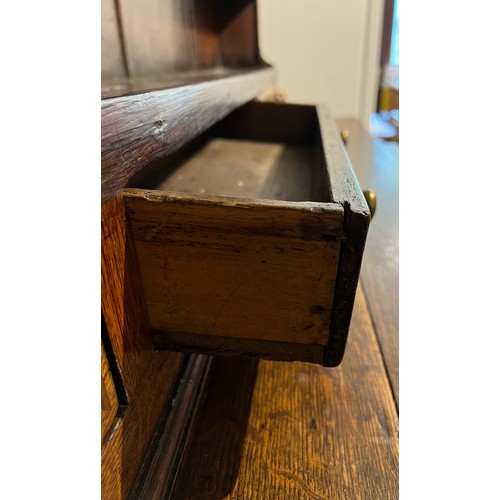 76 - Georgian oak dresser with break front base on bracket feet, four central drawers flanked by two cupb... 