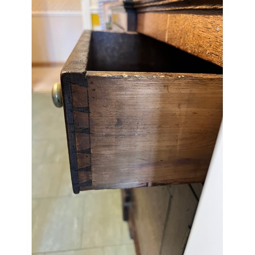 76 - Georgian oak dresser with break front base on bracket feet, four central drawers flanked by two cupb... 