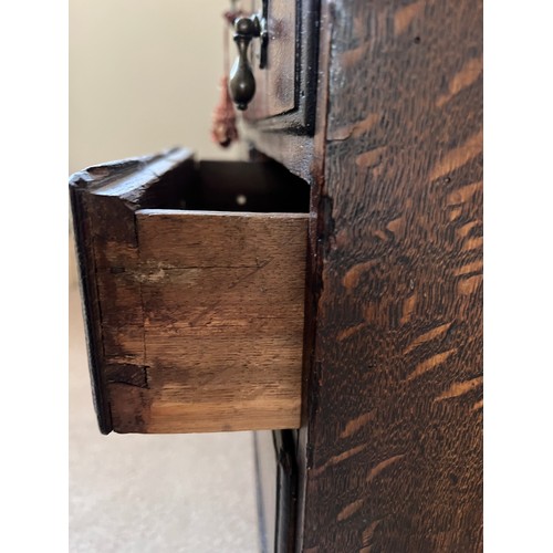 81 - Small oak chest with central door flanked by dummy drawers with others beneath. 63cm w x 44cm d x 64... 