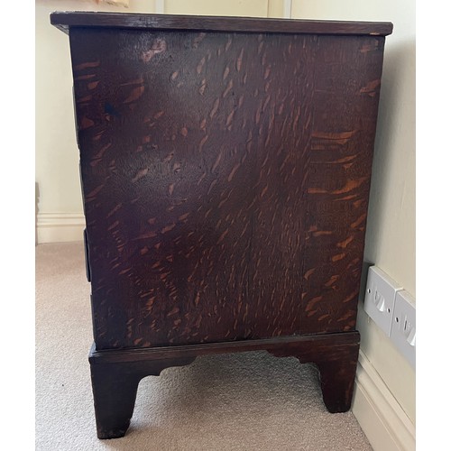 81 - Small oak chest with central door flanked by dummy drawers with others beneath. 63cm w x 44cm d x 64... 