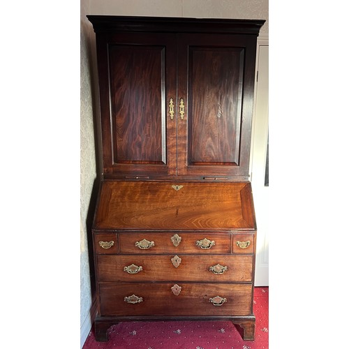 82 - An 18thC mahogany bureau bookcase with candle slides and original brass furnishings. 204cm h x 102cm... 