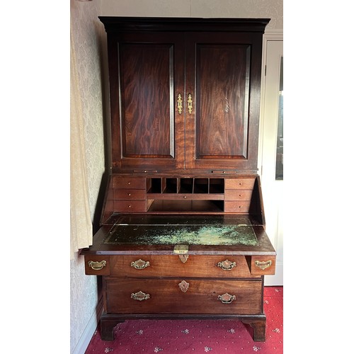 82 - An 18thC mahogany bureau bookcase with candle slides and original brass furnishings. 204cm h x 102cm... 